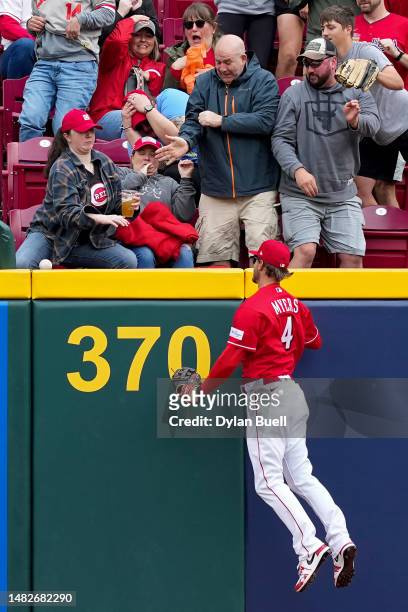 Wil Myers of the Cincinnati Reds looks on as a home run hit by Bryson Stott of the Philadelphia Phillies clears the fence in the first inning at...