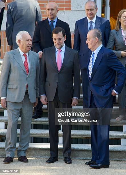 Minister of Foreign Affairs Jose Manuel Garcia Margallo, Prime Minister Mariano Rajoy and King Juan Carlos of Spain pose for the photographers before...