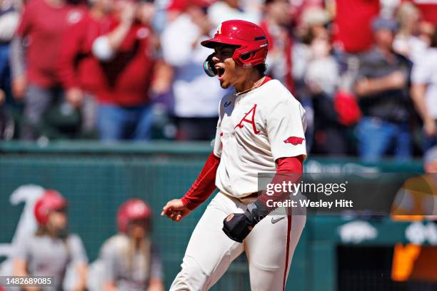Kendall Diggs of the Arkansas Razorbacks celebrates while crossing home plate for a run during a game against the Tennessee Volunteers at Baum-Walker...