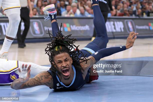 Ja Morant of the Memphis Grizzlies injures his hand during the second half against the Los Angeles Lakers during Game One of the Western Conference...