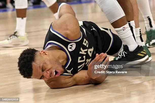 Giannis Antetokounmpo of the Milwaukee Bucks is injured during Game One of the Eastern Conference First Round Playoffs against the Miami Heat at...