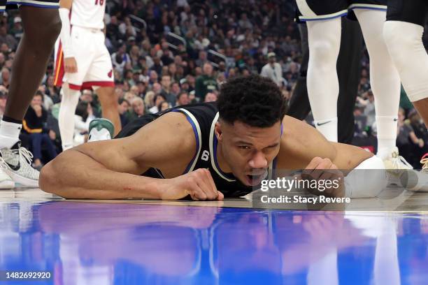 Giannis Antetokounmpo of the Milwaukee Bucks is injured during Game One of the Eastern Conference First Round Playoffs against the Miami Heat at...