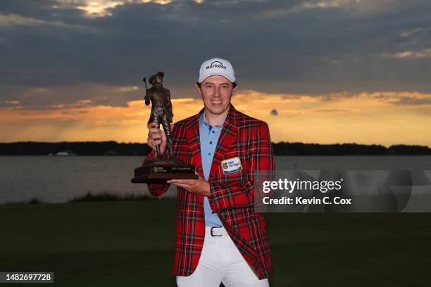 Matt Fitzpatrick of England celebrates with the trophy in the Heritage Plaid tartan jacket after winning in a playoff during the final round of the...