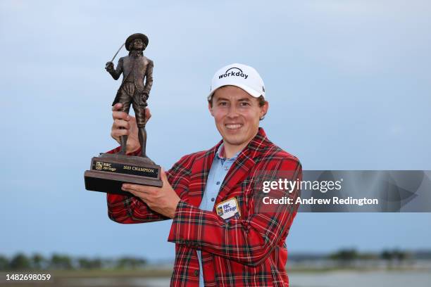 Matt Fitzpatrick of England celebrates with the trophy in the Heritage Plaid tartan jacket after winning in a playoff during the final round of the...