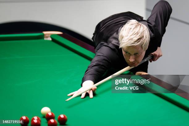 Neil Robertson of Australia plays a shot in the first round match against Wu Yize of China on day 2 of the 2023 Cazoo World Championship at Crucible...