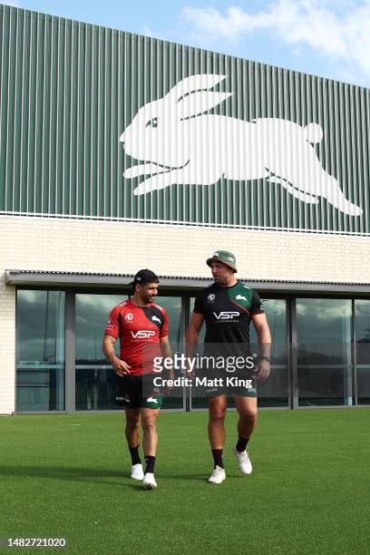 Cody Walker and Sam Burgess walk onto the field during a South Sydney Rabbitohs NRL Training Session at USANA Rabbitohs Centre on April 17, 2023 in...