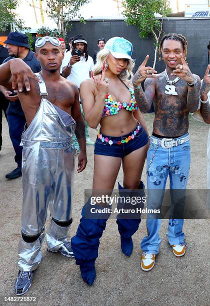 Slim Jxmmi of Rae Sremmurd, Saweetie, and Swae Lee of Rae Sremmurd pose backstage during the 2023 Coachella Valley Music and Arts Festival on April...