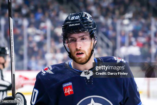 Pierre-Luc Dubois of the Winnipeg Jets looks on during a first period stoppage in play against the San Jose Sharks at the Canada Life Centre on April...