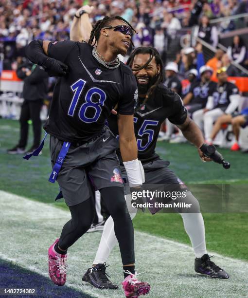 Justin Jefferson and Za'Darius Smith of the Minnesota Vikings and NFC celebrate after Jefferson scored an extra point against the AFC during the 2023...