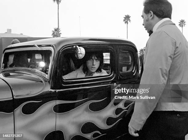 Musician Jeff Beck speaks with parking valet on arrival at 3rd Annual Rock Awards, held at The Palladium, Hollywood CA 1977