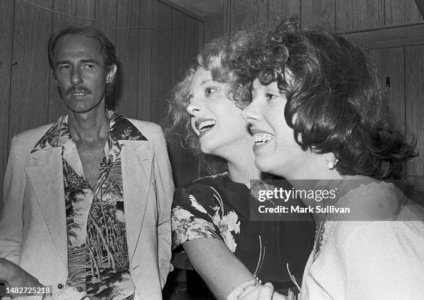 Singer/Songwriter John Phillips looks on as Actress Geneviève Waïte and Actress Mackenzie Phillips pose for photographers backstage at the Roxy, West...