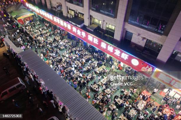 Barbecue restaurant in Zibo is packed with diners as long queues of customers wait for vacant tables on April 16, 2023 in Zibo, Shandong Province of...