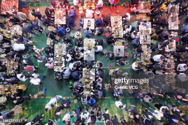 Barbecue restaurant in Zibo is packed with diners as long queues of customers wait for vacant tables on April 16, 2023 in Zibo, Shandong Province of...