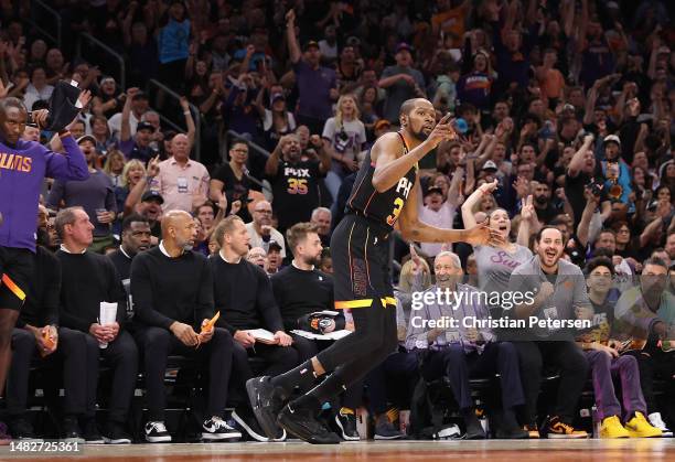 Kevin Durant of the Phoenix Suns reacts to a three-point shot against the LA Clippers during the second half Game One of the Western Conference First...