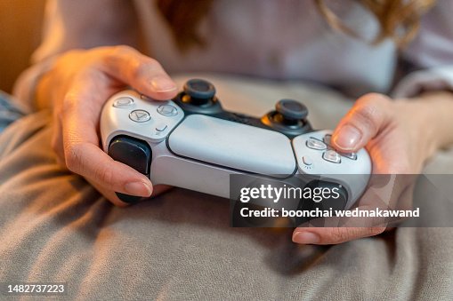 Hands with handheld game controls. Hands with handheld game controls.