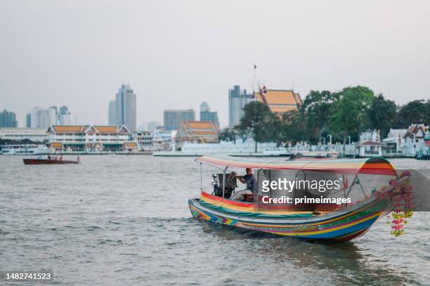 taxi boat and passenger ship on chaopraya river bangkok thailand - longtail boat stock pictures, royalty-free photos & images