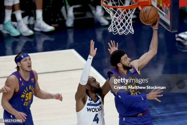 Jamal Murray of the Denver Nuggets goes to the basket against Jaylen Nowell of the Minnesota Timberwolves in the fourth quarter during Round 1 Game 1...