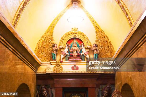phra sri maha mahatte devi, the god temple on the gopura of mariamman temple in bangkok, thailand - sri maha mariamman temple bangkok stock pictures, royalty-free photos & images