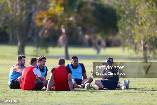 Wallabies coach Eddie Jones talks with players during an Australia Wallabies training camp at Sanctuary Cove on April 17, 2023 in Gold Coast,...