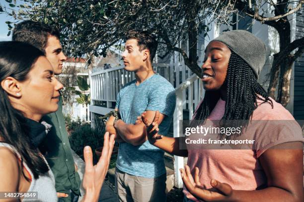 happiness multiracial friends talking outdoors in venice - la italia stock pictures, royalty-free photos & images