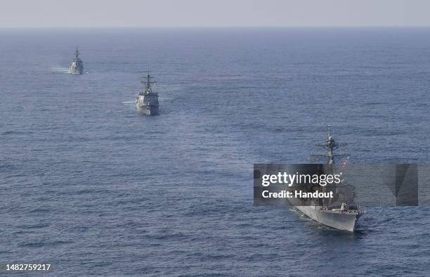 In this handout image released by the South Korean Defense Ministry, South Korean Navy's destroyer Yulgok Yi I , U.S. Navy's USS Benfold and Japan...