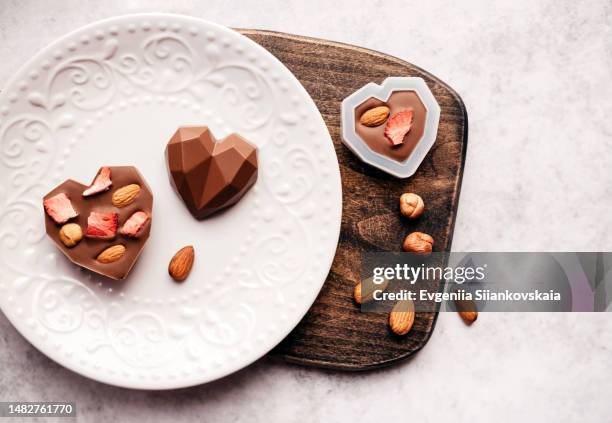 home made milk chocolate for valentine's day gift or another holiday. - chocolate white background stock pictures, royalty-free photos & images