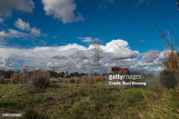 High voltage electricity transmission tower at Hexham outskirts of Newcastle on April 14, 2023 in Newcastle, Australia. Australia has pledged to cut...