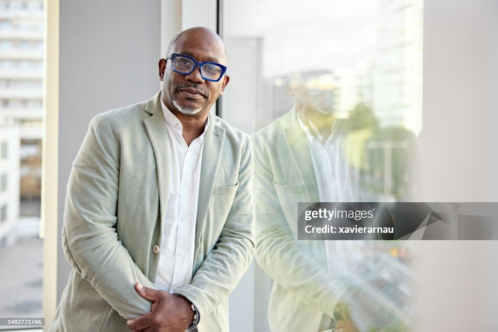 Office portrait of serious multiracial businessman