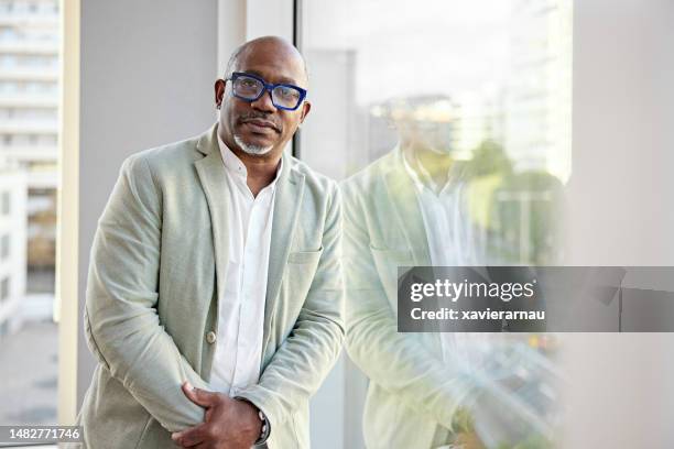 office portrait of serious multiracial businessman - colarinho aberto imagens e fotografias de stock