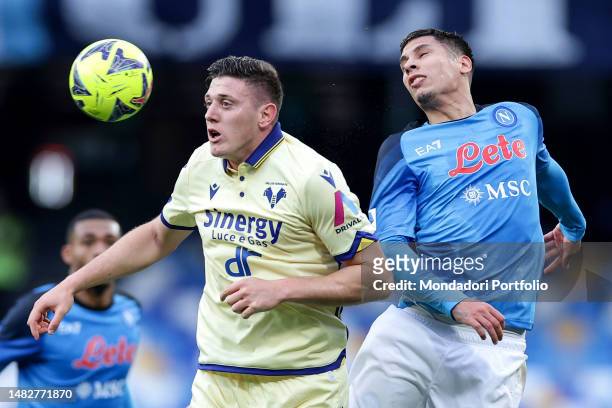 Adolfo Gaich of Hellas Verona and Mathias Olivera of SSC Napoli compete for the ball during the Serie A football match between SSC Napoli and Hellas...