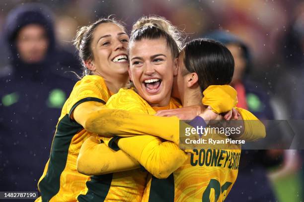 Charlotte Grant of Australia celebrates victory with teammates after defeating England during the Women's International Friendly match between...