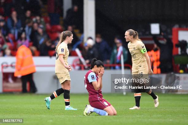 Kenza Dali of Aston Villa looks dejected as Maren Mjelde and Magdalena Eriksson of Chelsea celebrate following their team's victory in the Vitality...