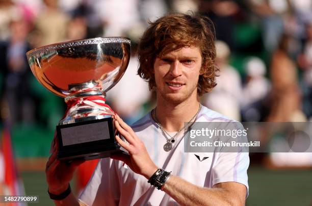 Andrey Rublev holds aloft the trophy after his three set victory against Holger Rune of Denmark in their singles final match during day eight of the...