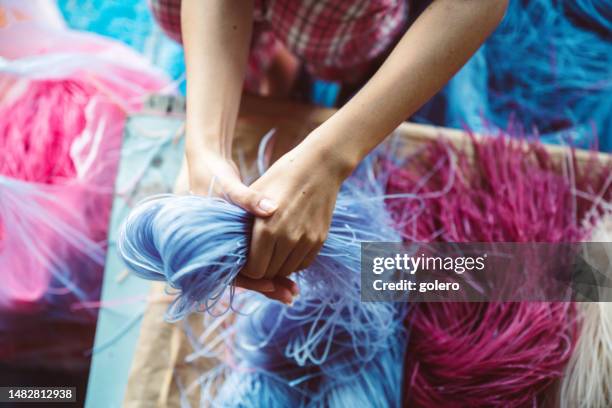 vietnamese woman sorting colorful rice noodles - rice production stockfoto's en -beelden