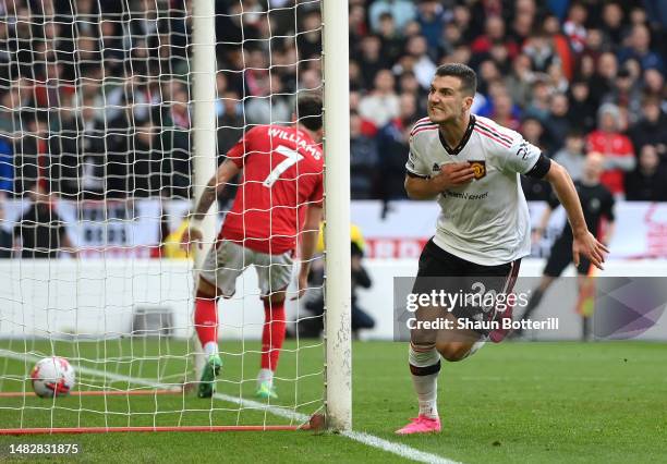 Diogo Dalot of Manchester United celebrates after scoring the team's second goal during the Premier League match between Nottingham Forest and...