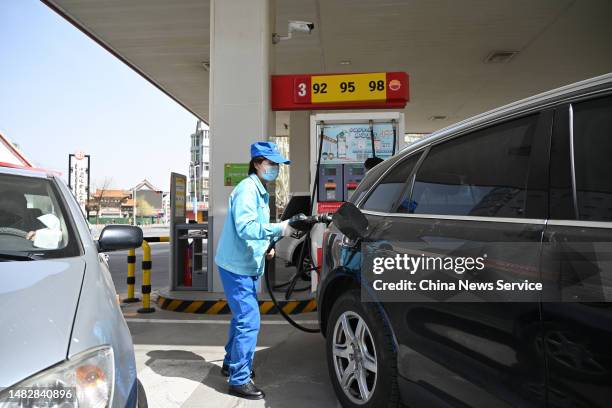 An employee refuels a car at a gas station of China National Petroleum Corporation on April 17, 2023 in Hohhot, Inner Mongolia Autonomous Region of...