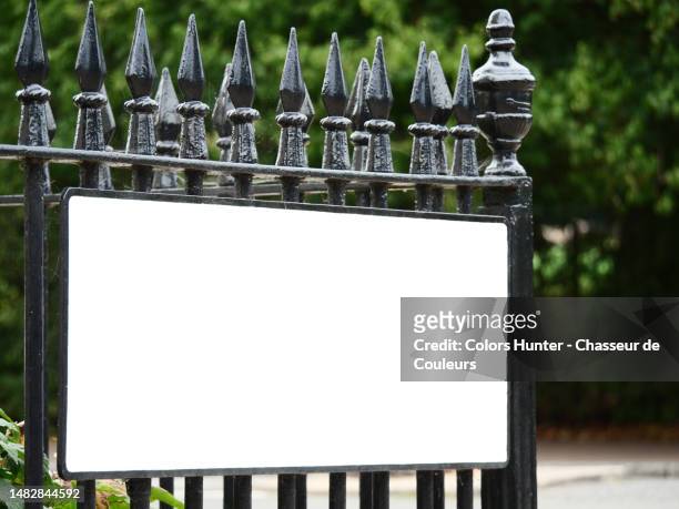 empty street name sign on a wrought iron gate on a street corner in london, england, united kingdom - commercial sign stock illustrations stock pictures, royalty-free photos & images