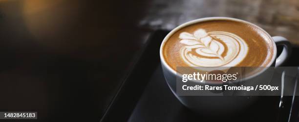 close up of hot latte coffee in the cafe,photo banner for website header design with copy space for,romania - coffee foam imagens e fotografias de stock