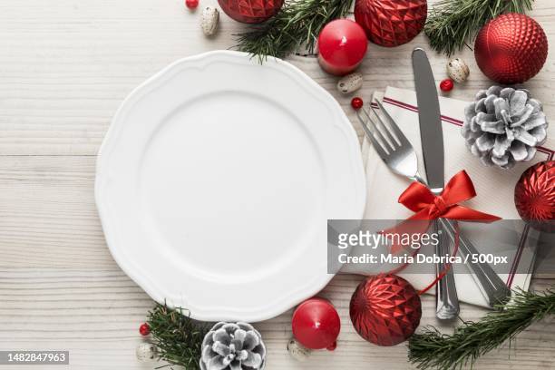 flat lay christmas tableware with empty plate high quality and resolution beautiful photo concept,romania - moments daily life from above imagens e fotografias de stock