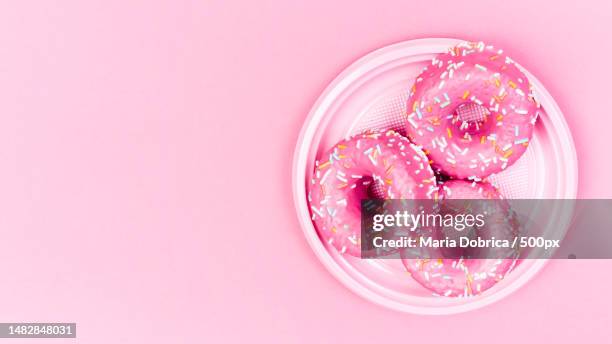 directly above shot of cookies in plate on pink background,romania - hundreds and thousands stock pictures, royalty-free photos & images