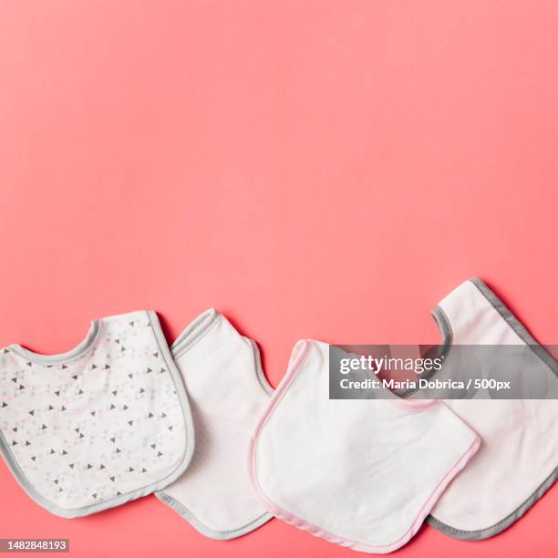 directly above shot of shoes on pink background,romania - baby bib stock pictures, royalty-free photos & images