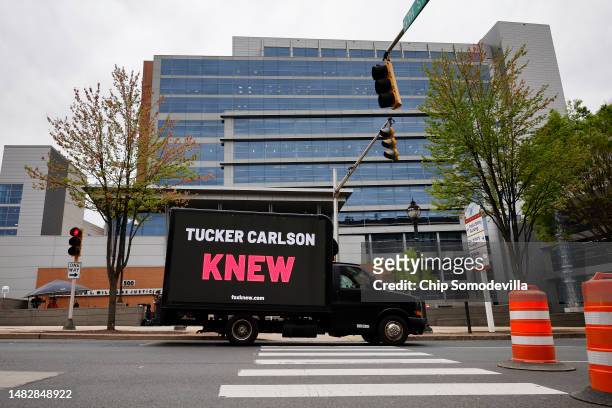 Truck with a digital sign saying, 'Tucker Carlson KNEW' drives past the Leonard Williams Justice Center where Delaware Superior Court Judge Eric...