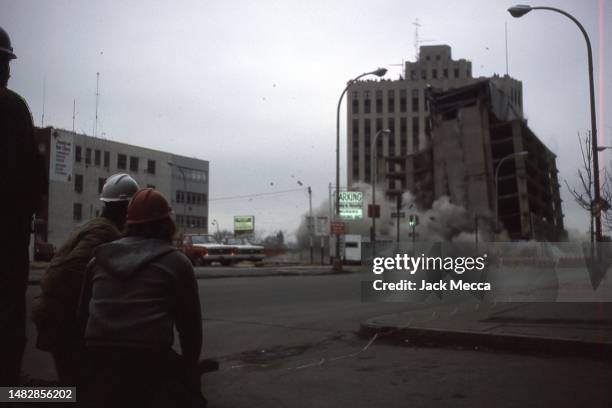 Parking garage demolition showing the wire from the detonator and observers in Albany, N.Y. October 1979.