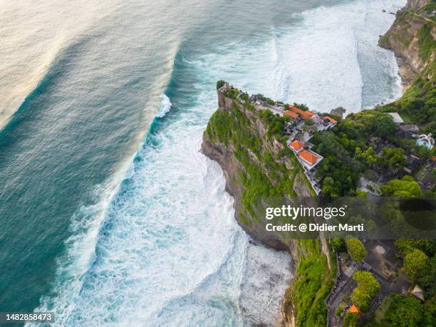 aerial view of uluwatu coast and temple in bali, indonesia - uluwatu stock pictures, royalty-free photos & images