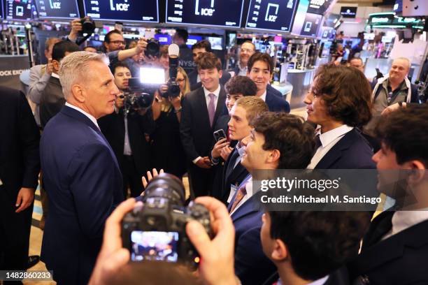 Speaker of the House Kevin McCarthy greets students from the Bergen Catholic High School Finance Club as he arrives on the floor of the New York...