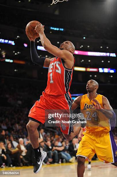 Sundiata Gaines of the New Jersey Nets drives to the basket against the Los Angeles Lakers during the game at Staples Center on April 3, 2012 in Los...