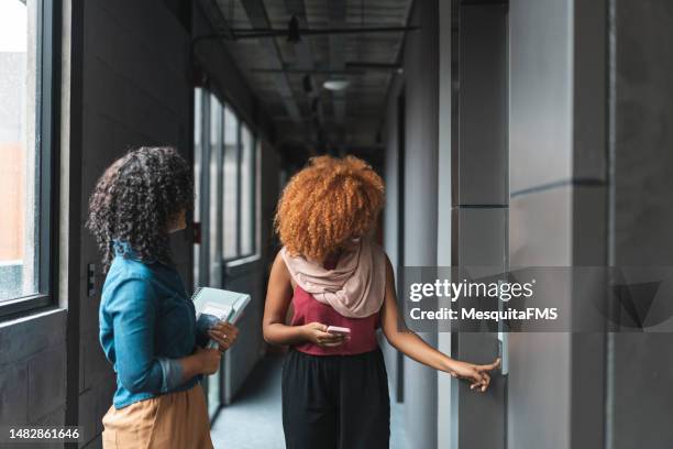 students opening the elevator door - open elevator stock pictures, royalty-free photos & images