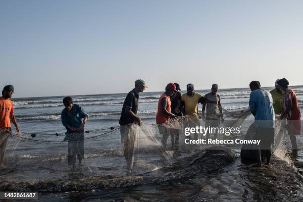 Pakistani fishermen bring in a catch at Clifton Beach on April 17, 2023 in Karachi, Pakistan. Pakistan's Supreme Court rejected a decision by the...