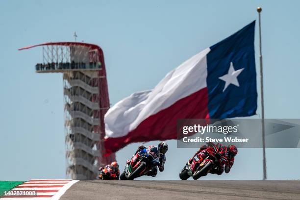 Francesco Bagnaia of Italy and Ducati Lenovo Team leads the race in front of Alex Rins of Spain and LCR Honda Castrol during the Race of the MotoGP...