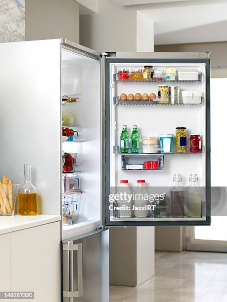 refrigerator in the kitchen - koelkast stockfoto's en -beelden